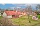 Scenic view of the spacious backyard with a well-maintained lawn, storage shed, and beautiful surrounding landscape at 528 Wind Skip Cir, Westfield, IN 46074