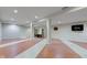 Spacious basement with neutral paint, built-in shelving, and modern lighting offers ample room for entertainment at 528 Wind Skip Cir, Westfield, IN 46074
