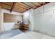 Unfinished basement area with workbench, pegboard and exposed ceiling beams at 528 Wind Skip Cir, Westfield, IN 46074