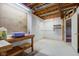 Unfinished basement with workbench, pegboard, exposed ceiling and doorway at 528 Wind Skip Cir, Westfield, IN 46074