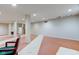 A large basement area, bathed in light, features built-in bookshelves and stylish design touches at 528 Wind Skip Cir, Westfield, IN 46074