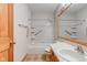 A bathroom featuring tile floor, a tub and shower combination, and a wood door and vanity at 528 Wind Skip Cir, Westfield, IN 46074