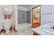 Well-lit bathroom with double sinks, storage and access to a walk-in closet and combination tub/shower at 528 Wind Skip Cir, Westfield, IN 46074
