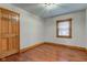 Clean bedroom featuring hardwood floors and a window that provides natural light at 528 Wind Skip Cir, Westfield, IN 46074