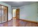 Bedroom featuring hardwood floors and a closet, with access to other rooms at 528 Wind Skip Cir, Westfield, IN 46074