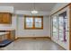 Cozy dining area with natural light, featuring wood trim, access to a screened-in patio, and kitchen access at 528 Wind Skip Cir, Westfield, IN 46074