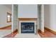 Close up on a fireplace with a wooden mantle and shelving on either side at 528 Wind Skip Cir, Westfield, IN 46074
