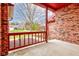 Relaxing front porch features a red railing, concrete floor and cozy outdoor space at 528 Wind Skip Cir, Westfield, IN 46074