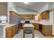 Traditional kitchen featuring stainless steel appliances, wood cabinetry, and an island at 528 Wind Skip Cir, Westfield, IN 46074