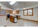 Well-lit kitchen featuring wood cabinets, stainless steel appliances, an island, and eat-in dining area at 528 Wind Skip Cir, Westfield, IN 46074