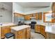 Traditional kitchen featuring stainless steel appliances, wood cabinetry, and an island at 528 Wind Skip Cir, Westfield, IN 46074
