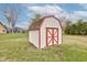 White shed with red trim in backyard at 528 Wind Skip Cir, Westfield, IN 46074
