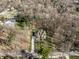 Beautiful aerial view of the home on a large lot, highlighting the mature trees and lush landscaping at 552 E 82Nd St, Indianapolis, IN 46240