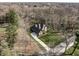 Aerial view featuring beautiful landscaping, a private driveway, and a well-maintained exterior at 552 E 82Nd St, Indianapolis, IN 46240