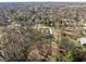 Picturesque aerial view showcasing a serene neighborhood with lush greenery and well-spaced homes at 552 E 82Nd St, Indianapolis, IN 46240