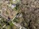 Stunning aerial shot of a home nestled amongst mature trees, showcasing its private and serene setting at 552 E 82Nd St, Indianapolis, IN 46240
