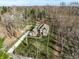 Expansive aerial view showcasing the home's generous lot and wooded surroundings, offering privacy and space at 552 E 82Nd St, Indianapolis, IN 46240