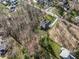 Stunning aerial view of a lush, green neighborhood with a variety of homes and mature trees at 552 E 82Nd St, Indianapolis, IN 46240