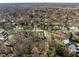 An aerial view of a sprawling neighborhood showcasing lush greenery and beautiful residential architecture at 552 E 82Nd St, Indianapolis, IN 46240