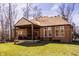 Spacious backyard with a covered patio, ideal for enjoying the outdoors with easy access to the home at 552 E 82Nd St, Indianapolis, IN 46240