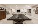 Spacious basement with ping pong table, modern lighting, and inviting lounge area for entertainment at 552 E 82Nd St, Indianapolis, IN 46240