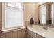 Well-lit bathroom features a modern sink and a window allowing for natural light at 552 E 82Nd St, Indianapolis, IN 46240