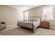 Inviting bedroom featuring plush carpeting, natural light, and comfortable furniture, with two large windows at 552 E 82Nd St, Indianapolis, IN 46240
