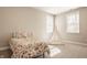 Bright bedroom with a floral themed bed, a teepee, and two windows that allows plenty of natural light at 552 E 82Nd St, Indianapolis, IN 46240