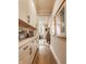 Hallway with built in storage, stone countertops, and light wood flooring at 552 E 82Nd St, Indianapolis, IN 46240