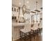 Gourmet kitchen with stainless steel appliances, a center island, and custom cabinetry at 552 E 82Nd St, Indianapolis, IN 46240