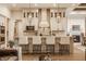 Modern kitchen with stainless steel appliances, a large island, and pendant lighting at 552 E 82Nd St, Indianapolis, IN 46240