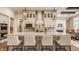 Gourmet kitchen with stainless steel appliances, a center island, and custom cabinetry at 552 E 82Nd St, Indianapolis, IN 46240