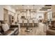 Open-concept living room showcasing kitchen with counter seating and view of dining area at 552 E 82Nd St, Indianapolis, IN 46240