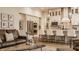 Open concept floor plan with seating and kitchen island featuring stone countertops and barstool seating at 552 E 82Nd St, Indianapolis, IN 46240