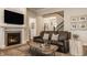 Cozy living room with a stone fireplace, comfortable seating, and stylish décor at 552 E 82Nd St, Indianapolis, IN 46240