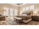 Serene main bedroom featuring multiple windows, a plush bed, and stylish furnishings at 552 E 82Nd St, Indianapolis, IN 46240