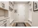 Well-organized mudroom with built-in storage, coat hooks, and bench seating at 552 E 82Nd St, Indianapolis, IN 46240
