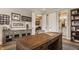 Spacious home office with custom cabinetry and large desk at 552 E 82Nd St, Indianapolis, IN 46240