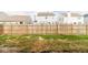 Backyard view of the property with a wooden fence at 5786 Blue Sky Dr, Whitestown, IN 46075