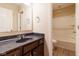 Bathroom with wood vanity, countertop and shower-tub combination and hardware at 5786 Blue Sky Dr, Whitestown, IN 46075