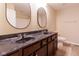 Bathroom featuring double sinks, wood cabinets and a modern design at 5786 Blue Sky Dr, Whitestown, IN 46075
