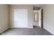 Bedroom showcasing carpet flooring, neutral walls and a closet, providing space and functionality at 5786 Blue Sky Dr, Whitestown, IN 46075