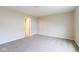 This spacious bedroom features neutral carpet, neutral walls and an ensuite bathroom at 5786 Blue Sky Dr, Whitestown, IN 46075