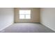 Neutral bedroom with plush carpet, window with blinds and neutral walls at 5786 Blue Sky Dr, Whitestown, IN 46075