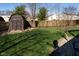 Backyard features a garden shed and ample green space at 5846 Edgewood Trace Blvd, Indianapolis, IN 46239
