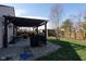 Backyard features a pergola with an outdoor seating area for relaxing and entertaining at 5846 Edgewood Trace Blvd, Indianapolis, IN 46239