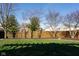 Backyard is surrounded by a well-maintained wood fence with lush green grass at 5846 Edgewood Trace Blvd, Indianapolis, IN 46239