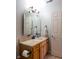 Bathroom featuring a single sink vanity with a stylish faucet and neutral colors at 5846 Edgewood Trace Blvd, Indianapolis, IN 46239