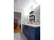 This bathroom has a double vanity and an open doorway, plus designer tile floor at 5846 Edgewood Trace Blvd, Indianapolis, IN 46239