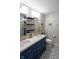 Modern bathroom featuring a double sink vanity with a designer tile floor at 5846 Edgewood Trace Blvd, Indianapolis, IN 46239